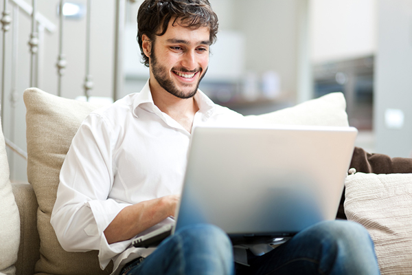 Boy using free online chat rooms without registration.